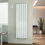 White vertical panel radiator with fins mounted on wall in a minimalist designer living room or hallway