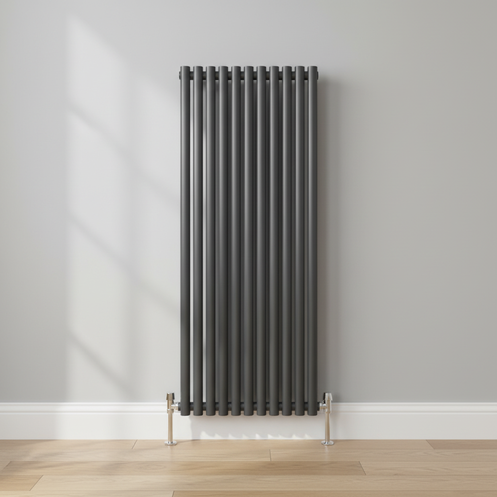Anthracite vertical radiator in room setting with chrome angled floor valves