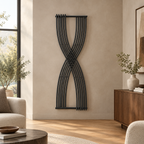 Sculptural dark vertical radiator in a warm contemporary home interior