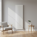 White vertical designer radiator with chrome valves in modern interior - square format